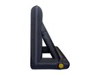 Black inflatable outdoor movie screen with a yellow air valve on the side.