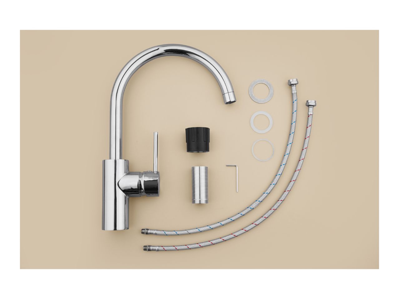 A chrome kitchen faucet and its installation parts, including hoses and washers, laid out on a beige surface.