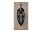 Black steam iron with a red indicator light on a beige surface.