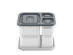 A clear and gray modular food storage container with multiple compartments.