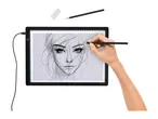 Hand drawing a portrait on a light pad with a pencil and eraser.