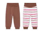 Zwei Babyhosen: eine braune und eine gestreifte in Weiß, Braun und Rot