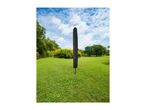 Black rotary washing line cover in a green garden with trees and blue sky.