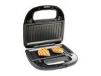 Open electric grill with two grilled chicken breasts
