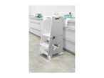 White wooden kitchen helper stool with a star cutout in a modern kitchen.