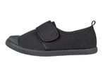 A single black canvas slip-on shoe with a velcro strap.