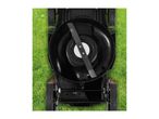 Overhead view of a lawnmower with its blade visible, sitting on green grass.