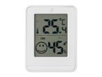 A white digital thermometer and hygrometer displays the temperature and humidity.