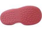 Pink shoe sole with embossed foot imprints.