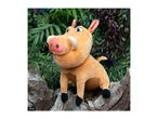 A plush Timon toy from Disney's The Lion King sits on a tree stump.