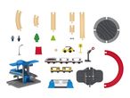 Toy train set with tracks, station, trains, figures, and accessories.