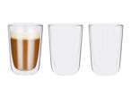 Three double-walled glasses, one filled with a latte, two empty.