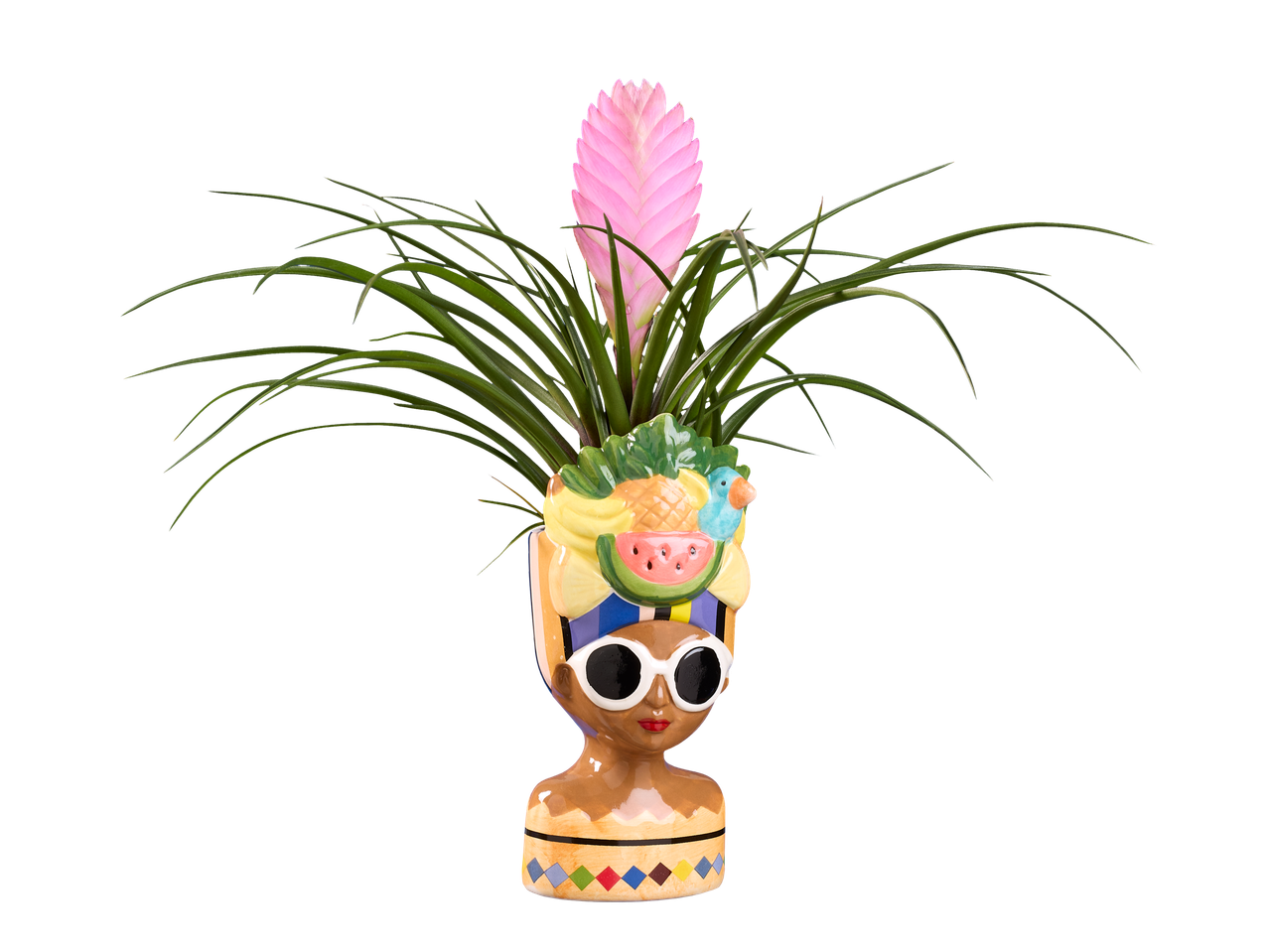 Roze lepelplant in een decoratieve bloempot in de vorm van een vrouwenhoofd met zonnebril.