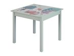 Light green children's table with a forest animal design, featuring a fox, bear, and trees.