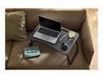 Laptop table with a laptop, mouse, pen, and drink on a sofa with a cushion.