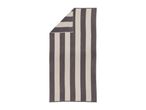Striped beach towel in grey and white, folded at the top left corner.