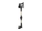 A black and silver cordless stick vacuum cleaner stands upright.