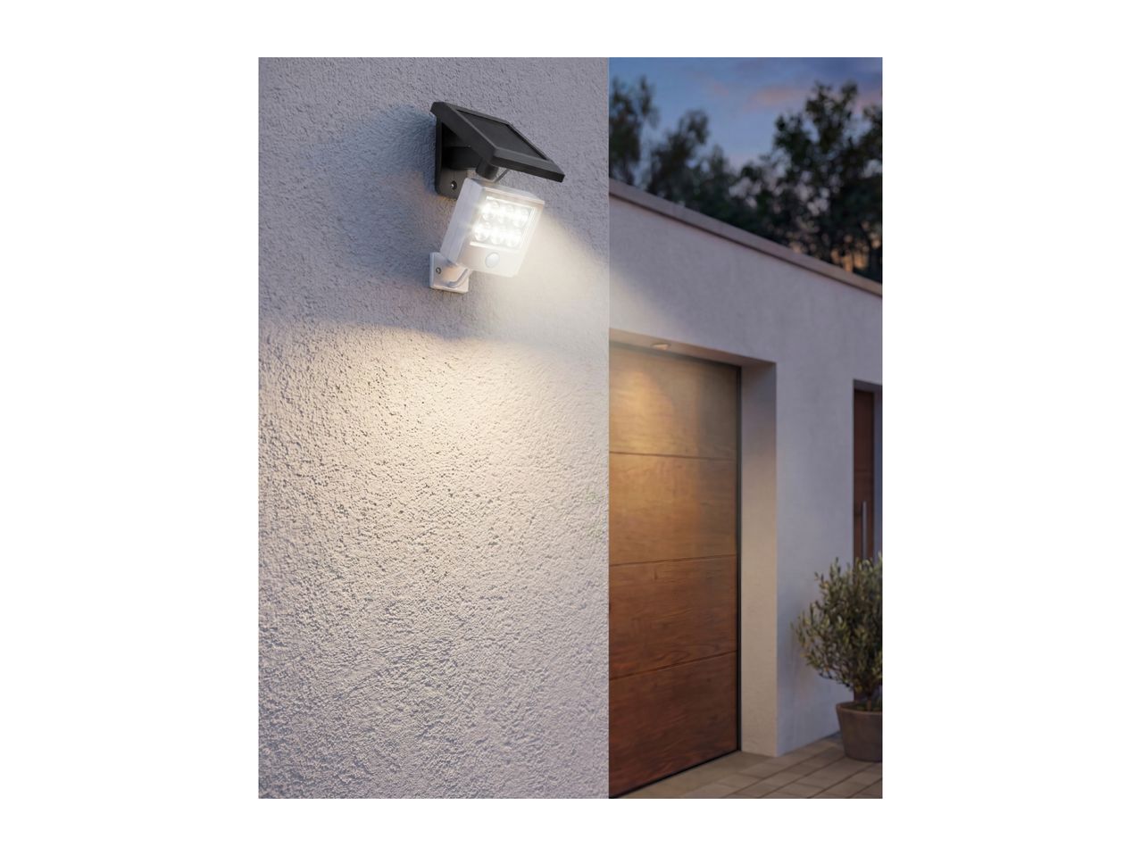 Solar-powered LED outdoor wall light with motion sensor illuminating a house entrance