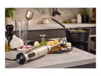 Silvercrest hand blender on a kitchen counter with soup and ingredients.