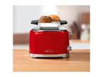 Red retro toaster with a warming rack and two bread rolls on a wooden table
