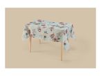 Light blue floral tablecloth on a wooden table.