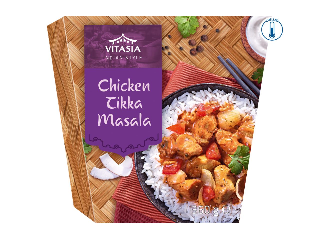 Chicken Tikka Masala with rice, served in a bowl on a woven mat, chilled.