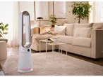 Un ventilatore senza pale TRONIC® in un soggiorno moderno con divano e tavolino da caffè.