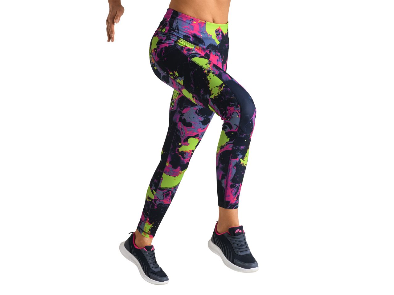 Woman wearing colorful patterned leggings and dark athletic shoes.