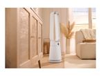 White air purifier in a bright living room with a wooden cabinet and beige sofa.