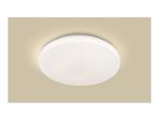 Round white LED ceiling light with warm glow on a beige background