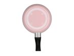 Bottom of a pink frying pan with a black handle, showing various symbols and 'made in Italy' text.