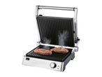 A stainless steel contact grill cooks two steaks.