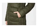 Close-up of a person wearing a dark green puffer jacket with their hand in the pocket
