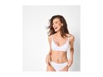 Smiling woman in white lace-trimmed bralette and briefs.