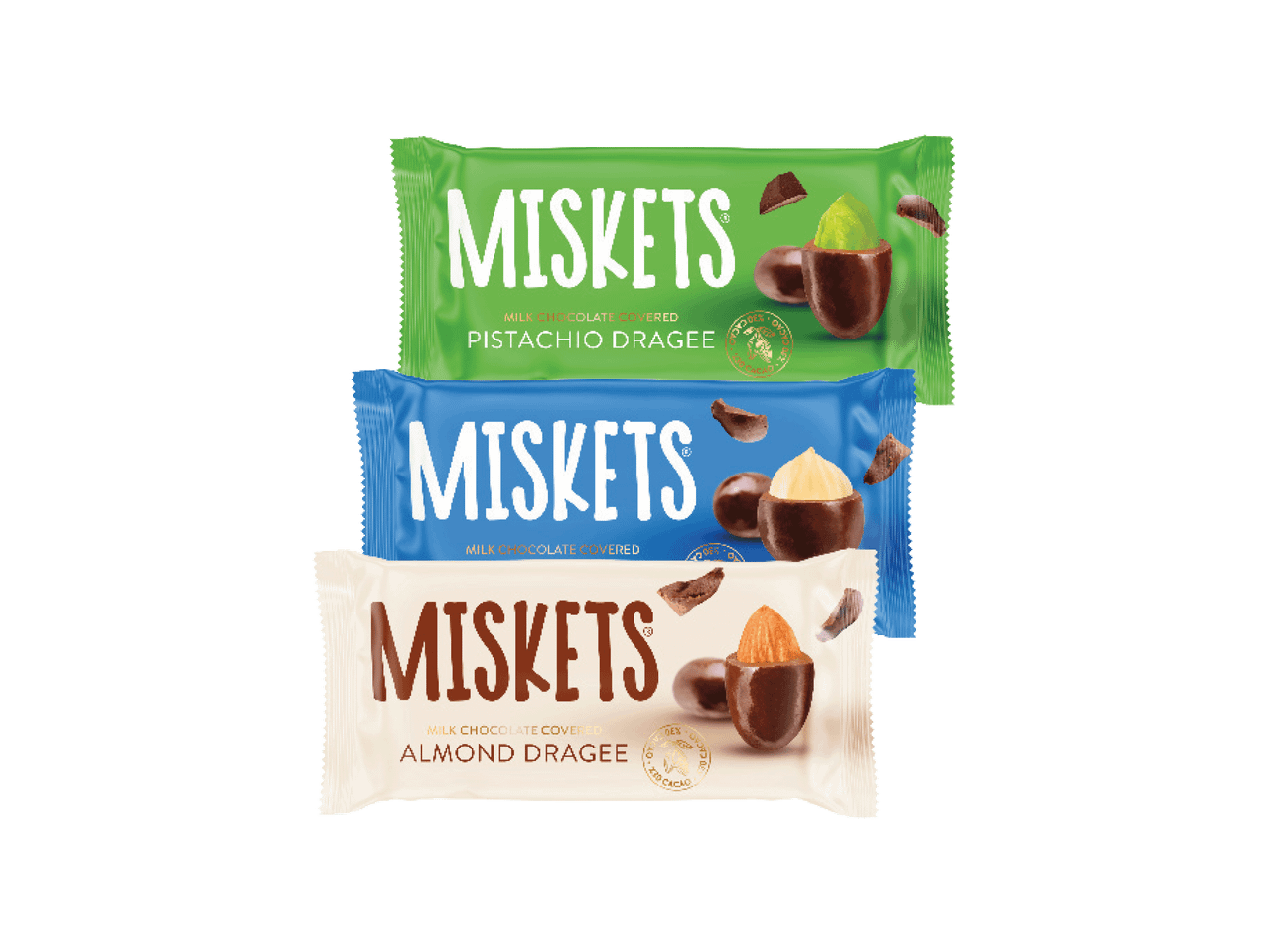 Trys „Miskets“ šokoladu aplietų riešutų pakuotės: pistacijų, lazdyno riešutų ir migdolų.