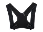 Black posture corrector with mesh straps and adjustable buckles, designed to improve back alignment.