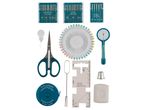 A sewing kit with needles, scissors, pins, measuring tape, seam gauge, thimble, and tailor's chalk.