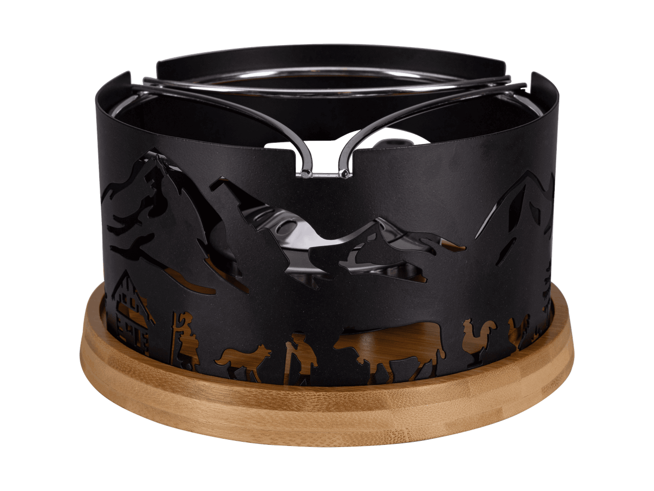 Chauffe-plat noir avec découpes de montagne et de ferme sur une base en bois.