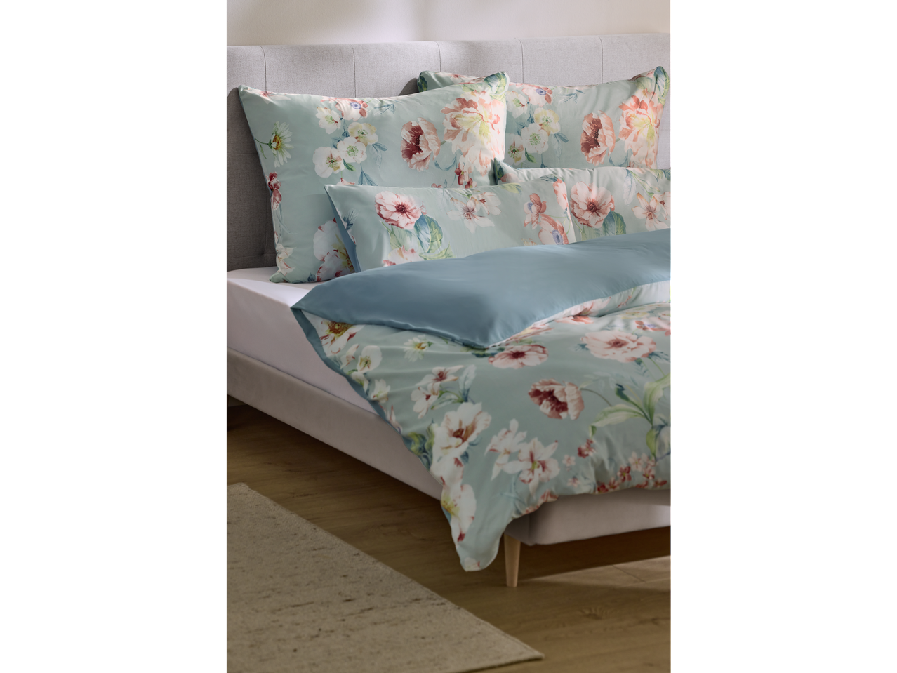 Livarno Microfibre Sateen Duvet Cover Set with floral pattern on a bed.
