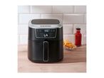 Silvercrest air fryer with fries and sauce on a wooden counter