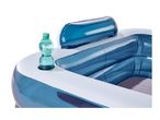 Inflatable blue and white paddling pool with a water bottle in a cup holder
