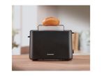 Black toaster with a bread roll on top, sitting on a wooden counter.