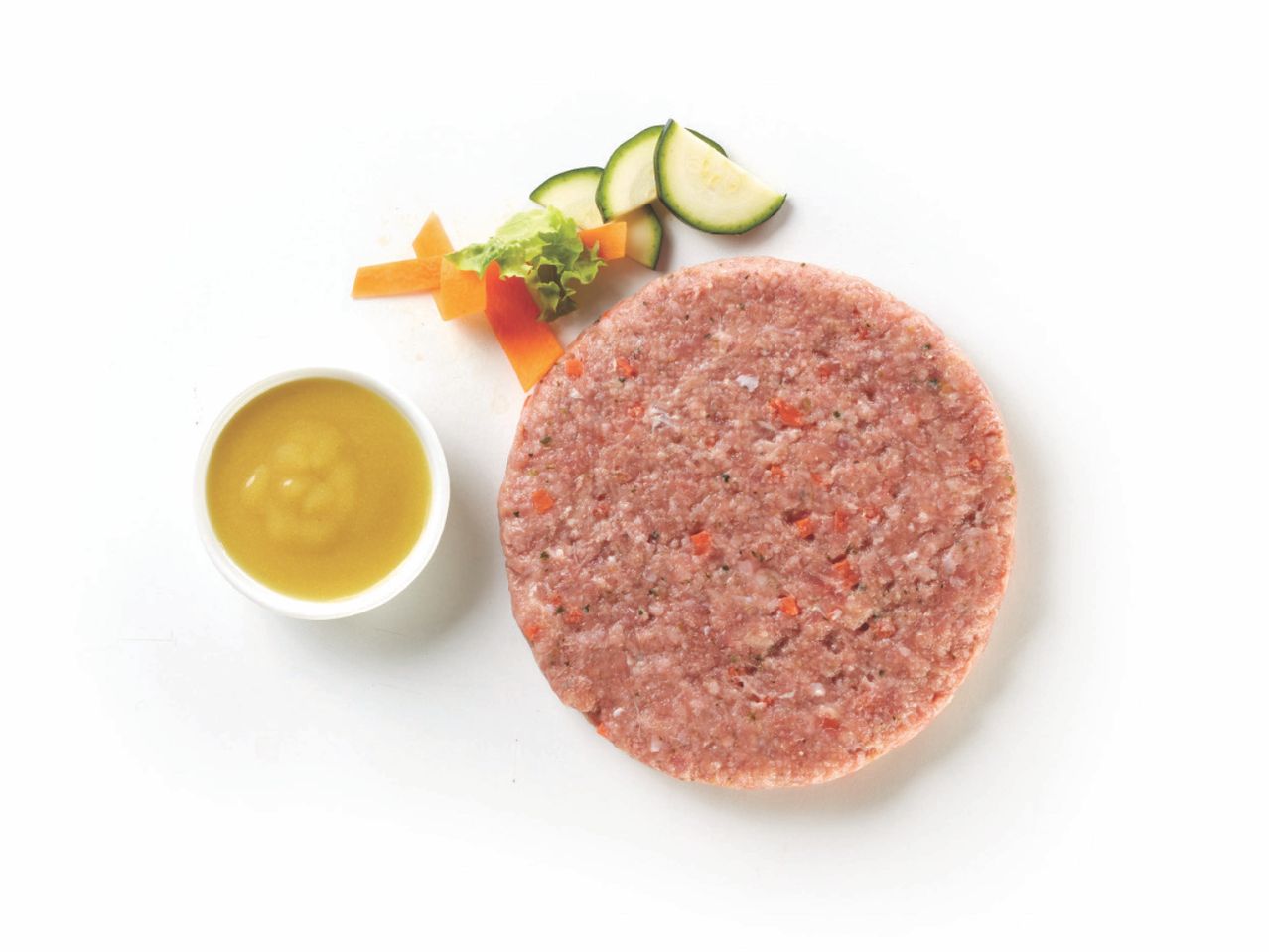 Hamburger di carne con salsa e verdure.