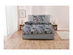 A bedroom with a bed featuring floral bedding, two nightstands, and a rug.