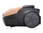 Side view of a modern vacuum cleaner with a beige top and dark gray body and wheels