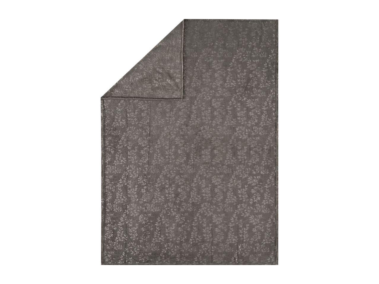 Grey patterned blanket with a folded corner