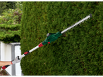 PARKSIDE® 20 V battery-powered telescopic hedge trimmer, cutting a hedge.