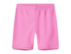 Pink cycling shorts for children, made from a stretchy fabric.