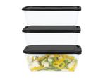 Stack of three rectangular food containers with black lids, one filled with salad.