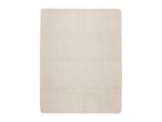 A rectangular beige bath mat with a textured surface and rounded corners.